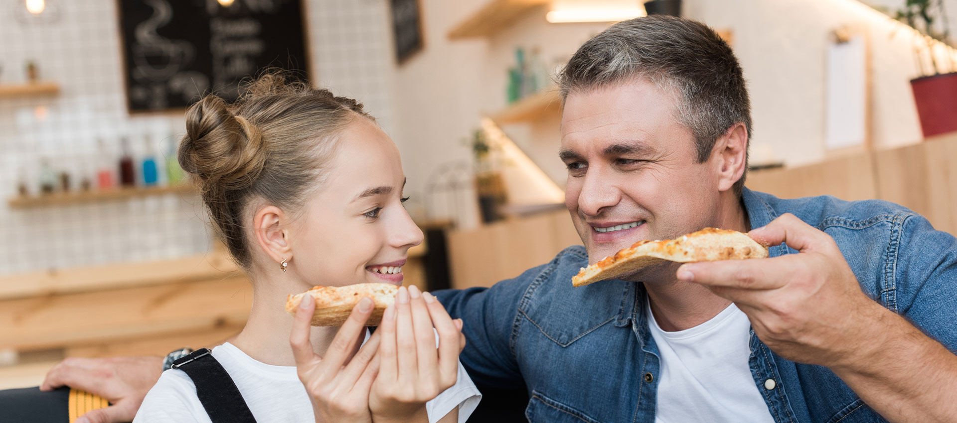 Father and Daughter enjoying a meal at a Italian Restaurant 